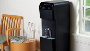Water cooler dispensing clean filtered water in an office setting